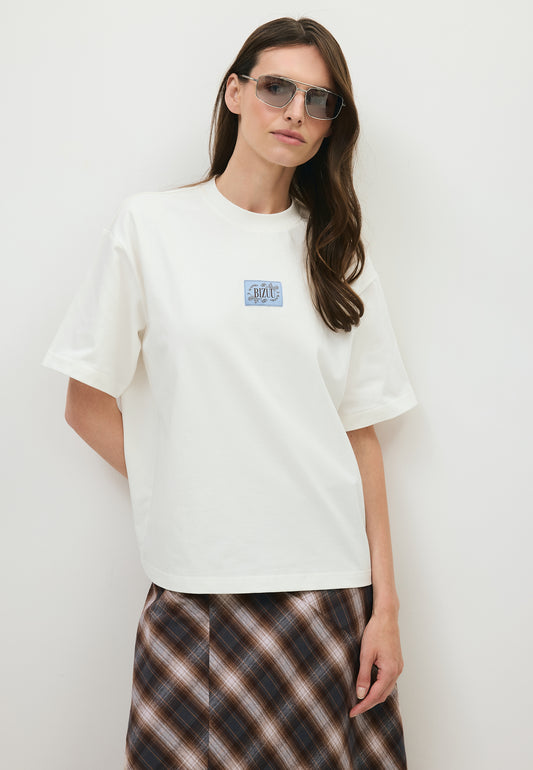 Kremowy t-shirt oversize PARADISO z logo