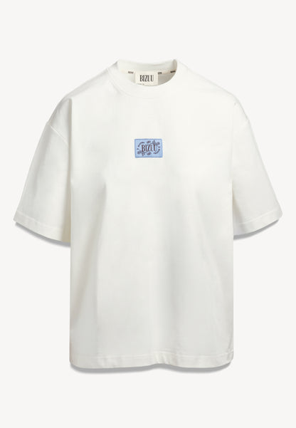 Kremowy t-shirt oversize PARADISO z logo